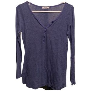 Ricki’s small Henley like blue shirt with adjustable sleeves.